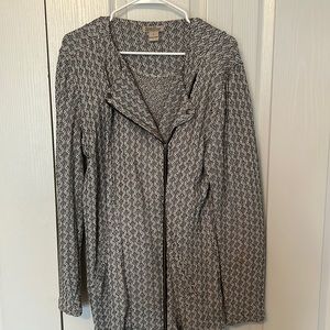 Light Jacket/ Cardigan. Black and white with a zipper. Cute button detail.